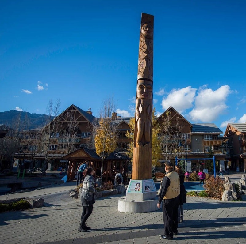 Olympic lightning welcome figure wooden carving in Whistler village